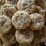 A stack of Crackly Sugar Cookies features metallic sprinkles and sugar on top.