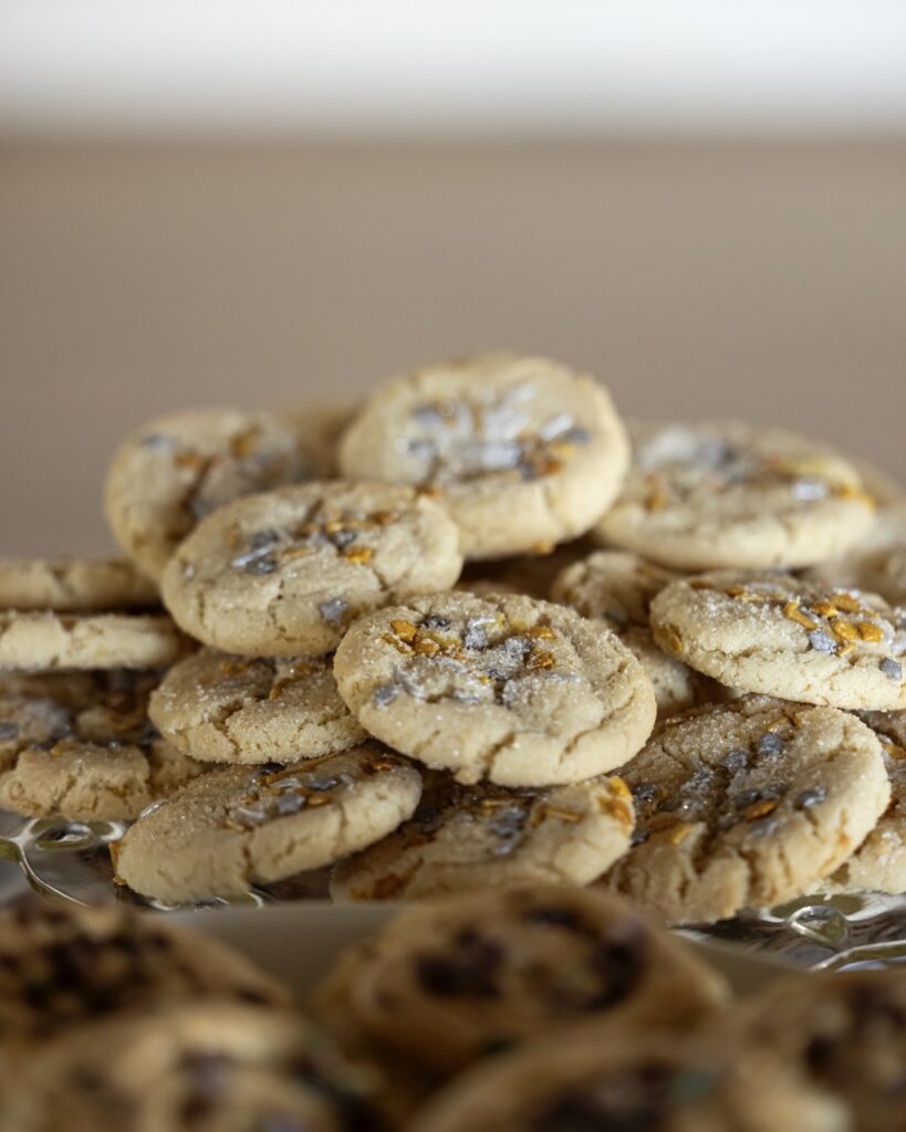 A stack of Crackly Sugar Cookies includes touches of gold and metallic sprinkles. 