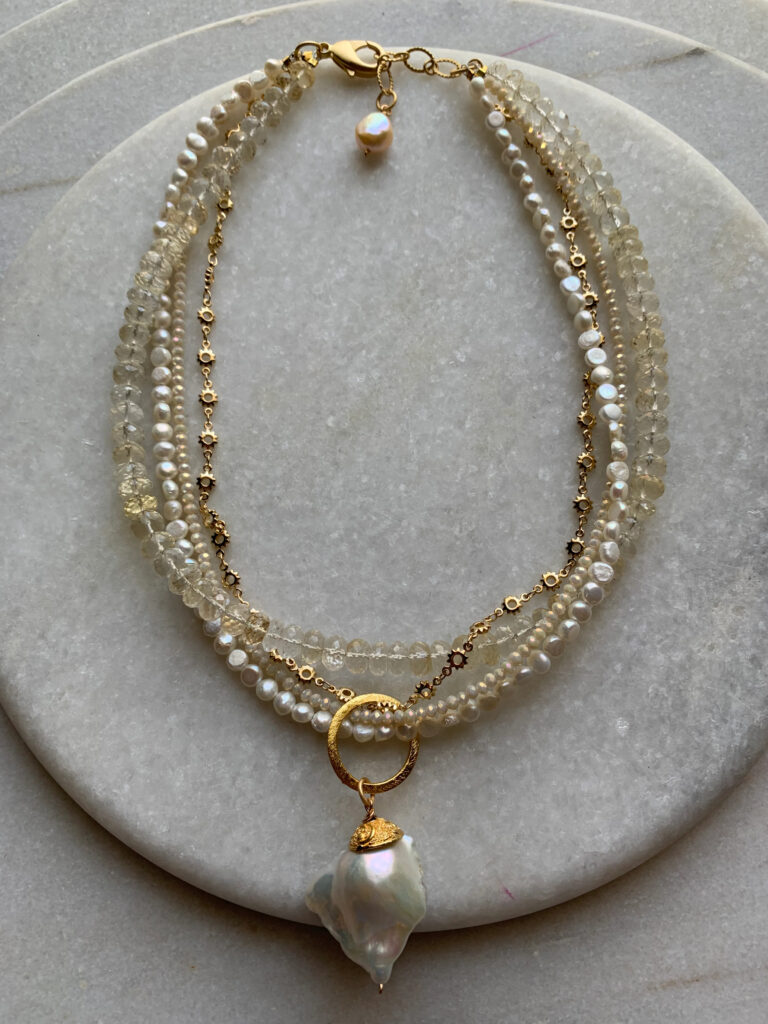 A gold necklace with multiple strands