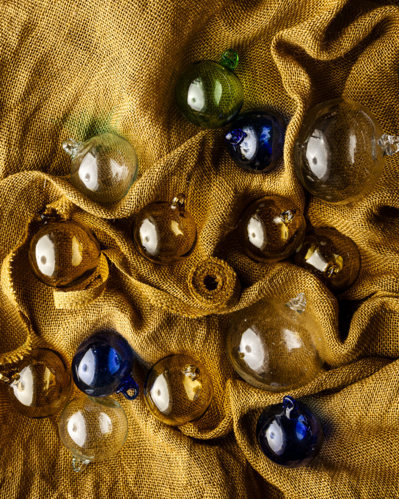 Handblown glass baubles made from recycled glass