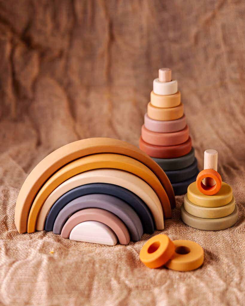 Two stacks of wooden rings and a rainbow stacking toy. Gift Ideas for Kids