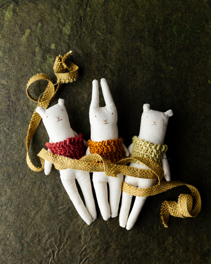 Three small stuffed animals with various colored little vests. Gift Ideas for Kids