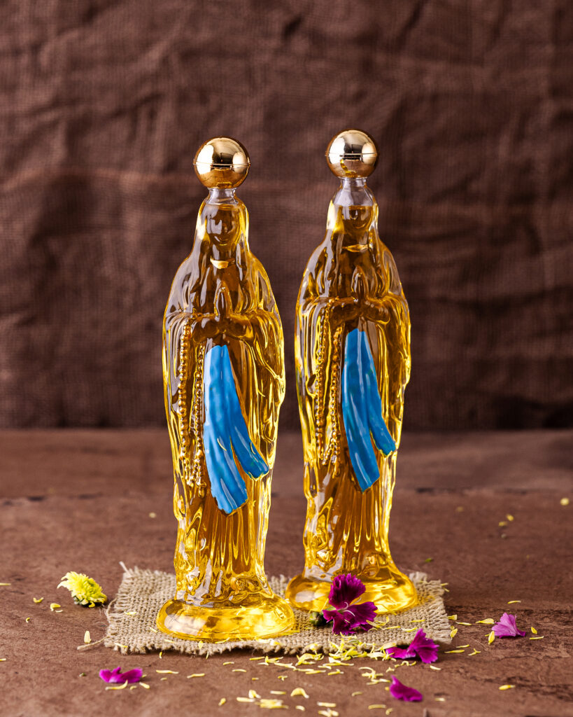 Two bottles of olive oil that look like the virgin mary. Food and Drink Gift Ideas