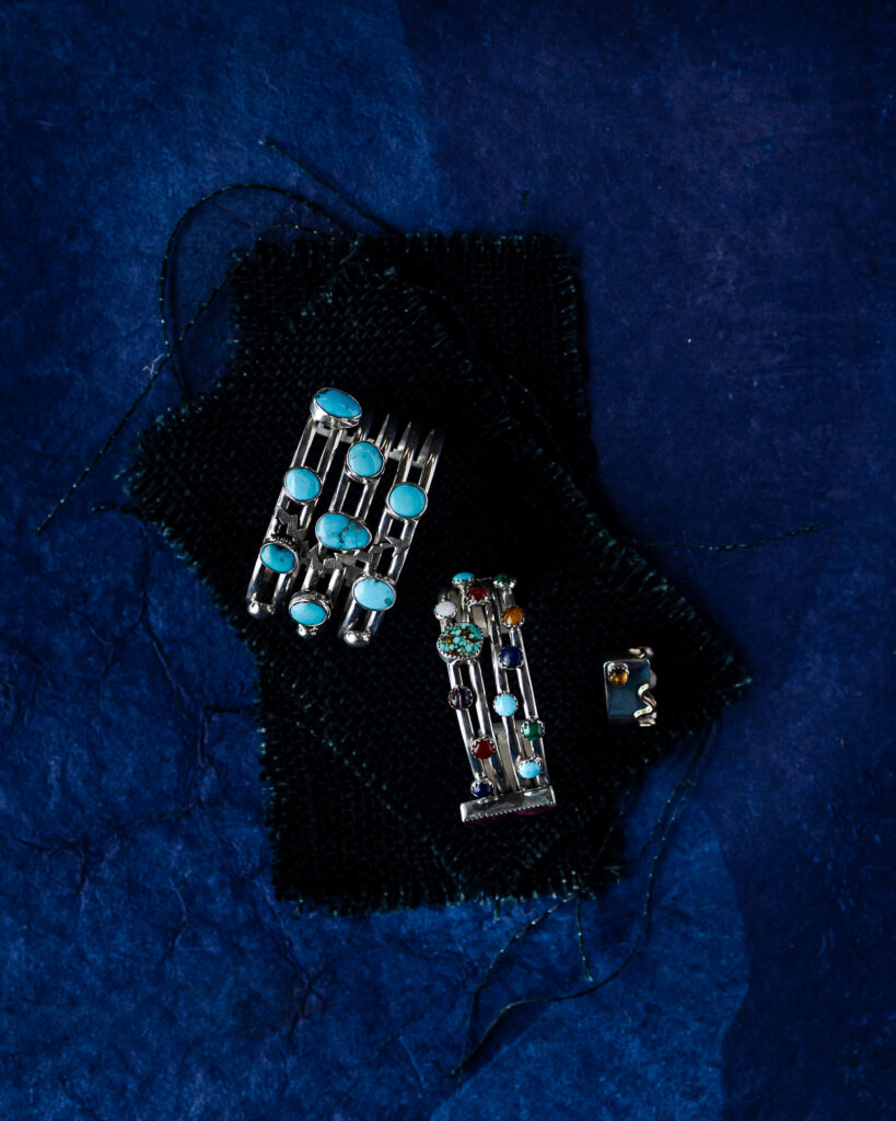 Silver bracelets studded with a constellation of turquoise and other gems