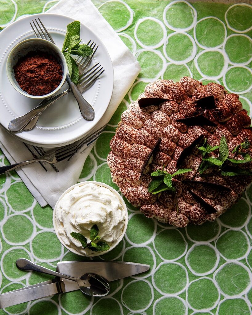 An aerial view of Chocolate Mint Pie with a side of whipped mint cream. Chocolate Mint Pie Recipe