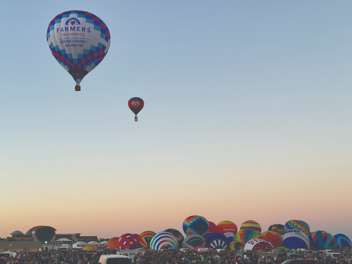 Hot air balloons ascending at the Albuquerque International Balloon Fiesta, showcasing the vibrant colors and mass ascension of the largest balloon event in the U.S.