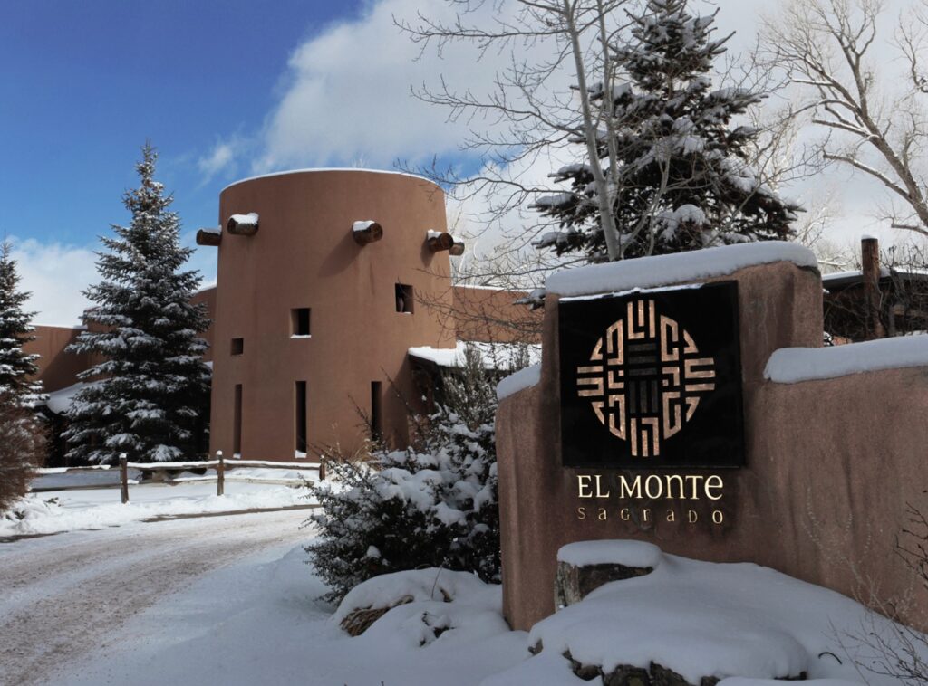 A Winter Staycation at El Monte Sagrado The outside of El Monte in an aztec style with snow everywhere.