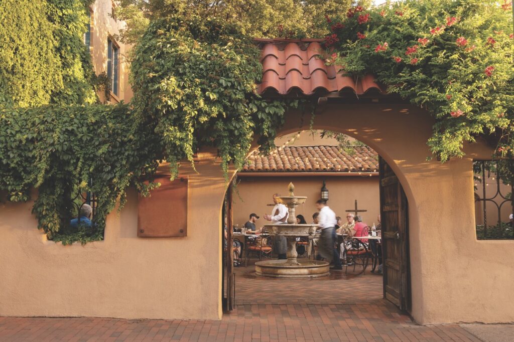 The brown arch outside of a Heritage Hotels restaurant in New Mexico.