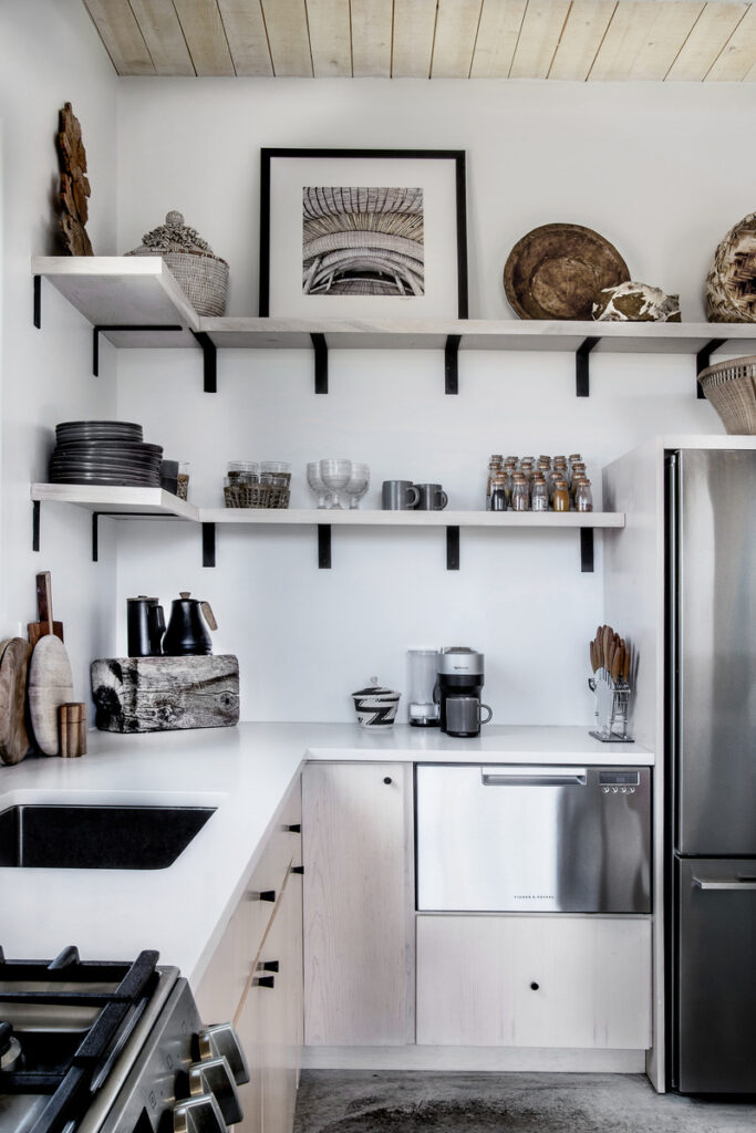 Modern rustic kitchen with open shelving, minimalist decor, and natural wood accents.