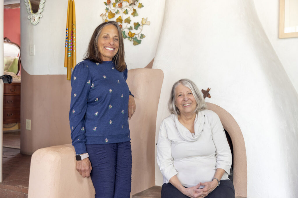 Sharon Woods and Christine Mather in a Southwestern-style home.