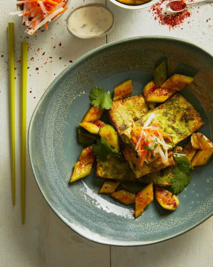 a blue bowl filled with Deconstructed Tofu Bahn Mi on top of a table.