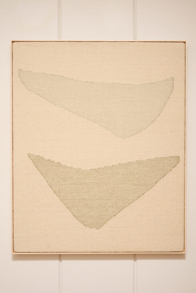 A minimalist textile artwork featuring two abstract, elongated shapes with subtle texture