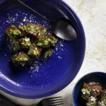 A blue bowl of Gnocchi alla Romana with Pesto Genovese