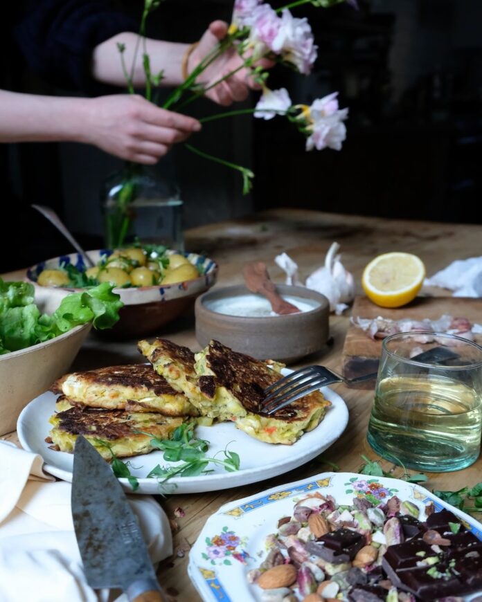 Leek, Feta, Chili, Dill Fritters Leeks, feta, chili, and dill fritters on a spring table.