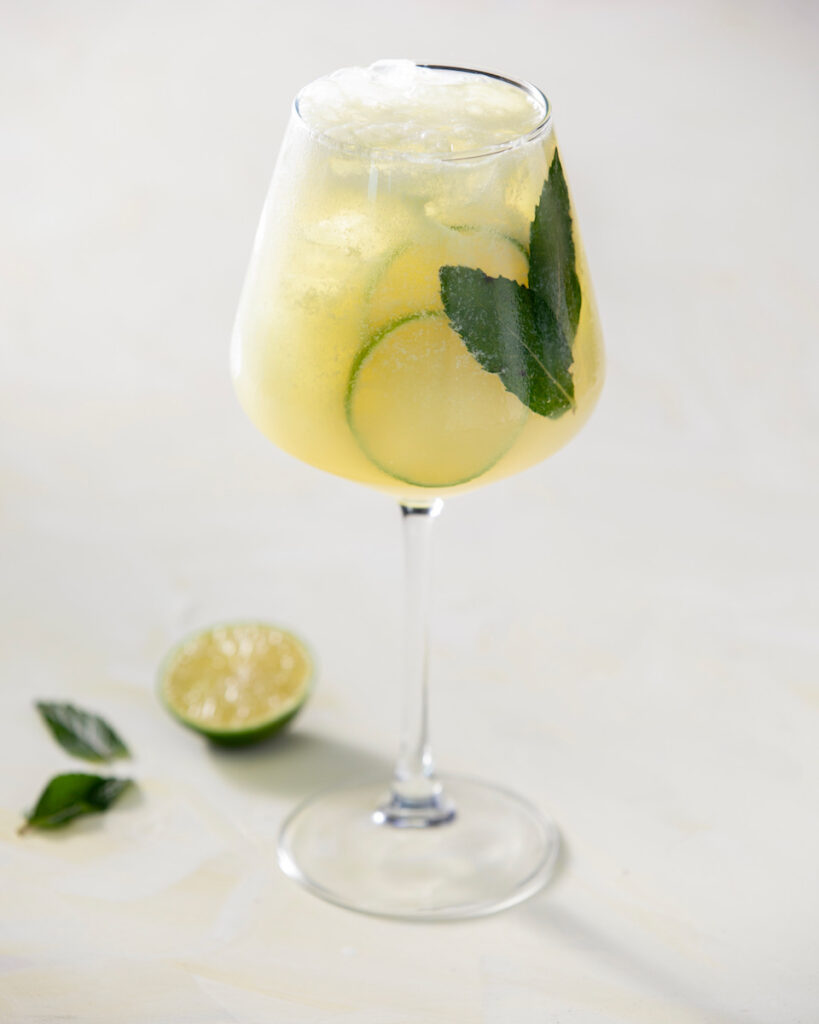 An absinthe spritz on a white background