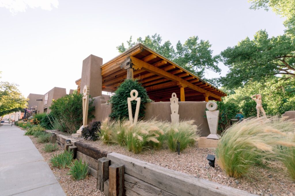 Outdoor garden area with several tall, abstract stone sculptures.