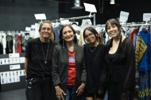 Native Fashion Week 2025 10 TABLE Magazine Four women smile and stand together.
