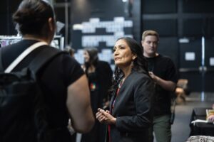 Native Fashion Week 2025 3 TABLE Magazine A woman listens to another woman speak.