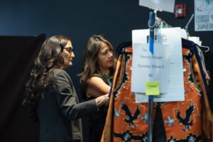 Native Fashion Week 2025 9 TABLE Magazine Two women look through a clothing rack.