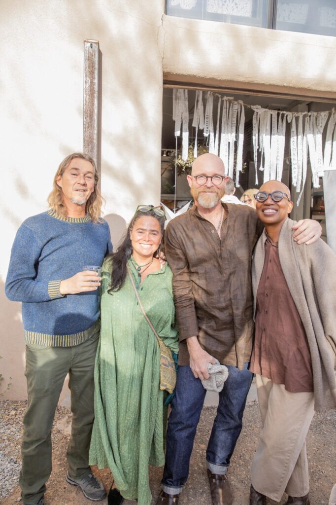 Spring Launch Party 27 TABLE Magazine Four people smile together outside.