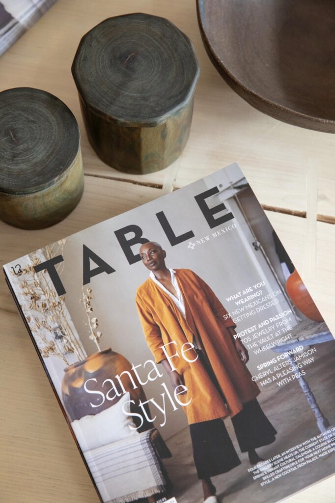 Spring Launch Party TABLE Magazine A TABLE Magazine spring issue sits on a wood table.