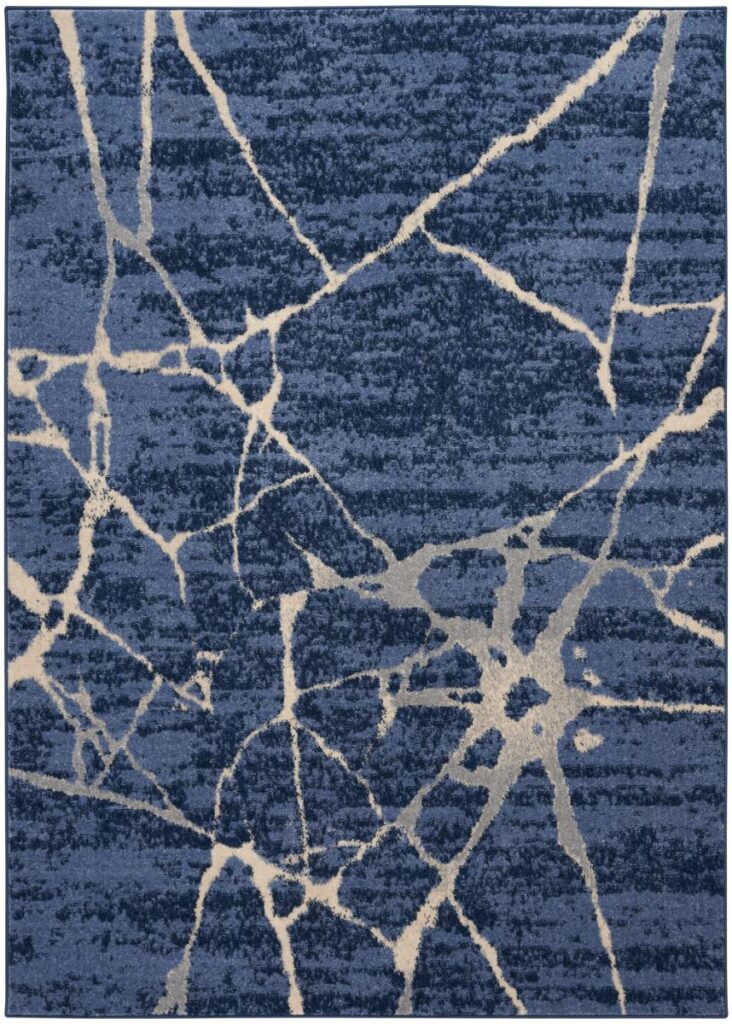 A rug with a blue and white cracked-stone pattern is shown.