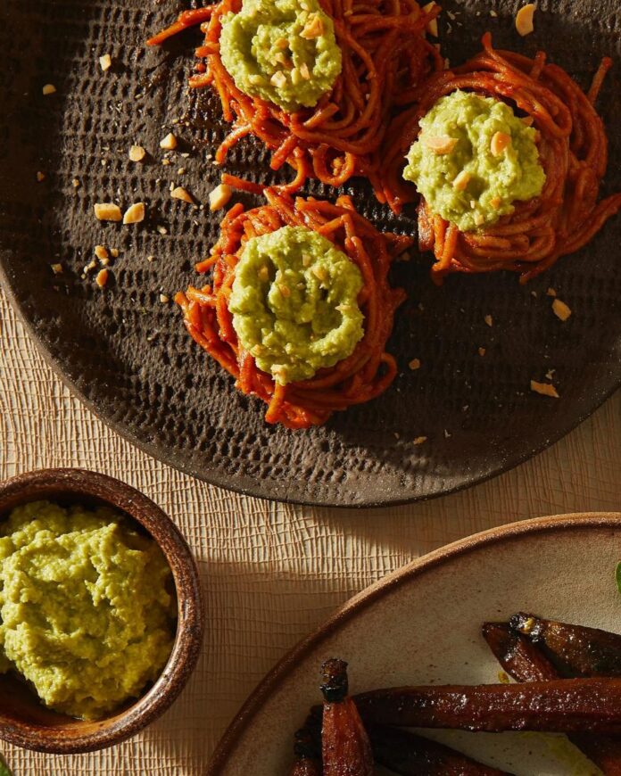 Soba noodles tossed in vindaloo sauce, arranged in nests and topped with edamame puree.