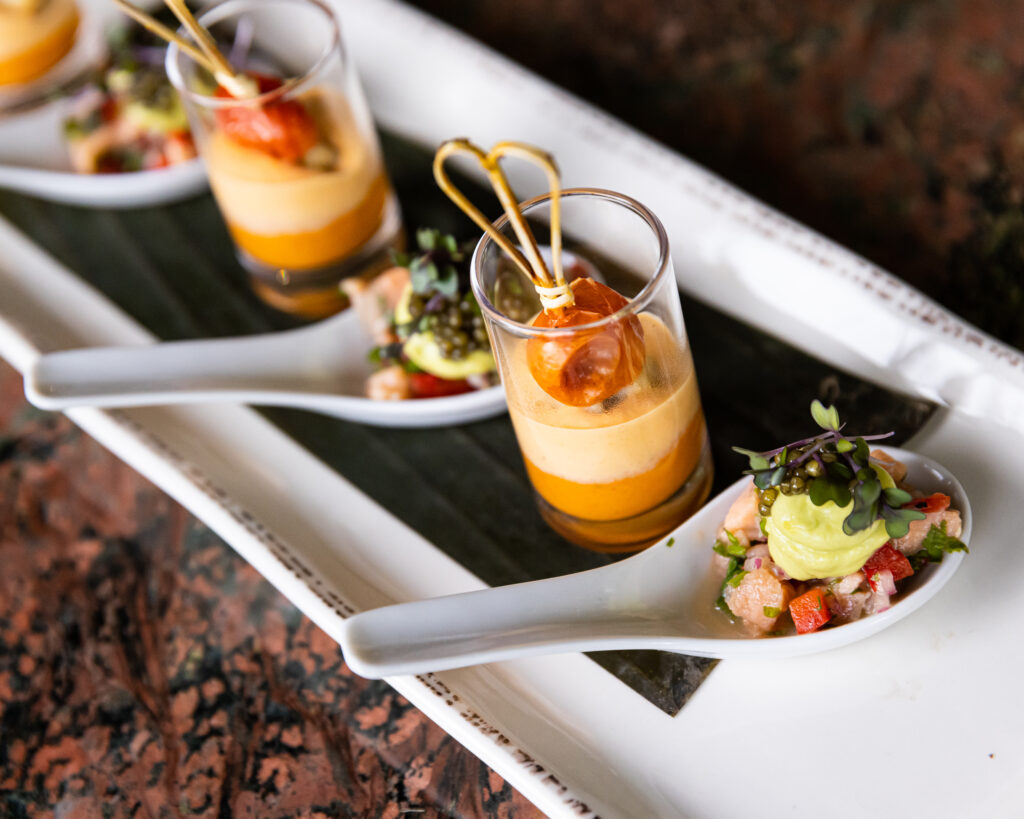 white plate with glass cups with food inside colored yellow