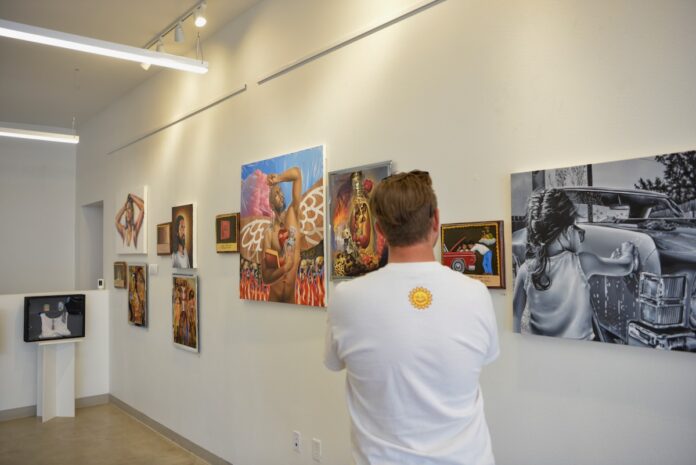 Authentically Albuquerque man observes exhibit in The B. Ruppe Drugstore