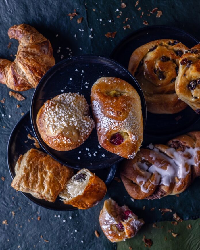 Pastries on a black stone sheet