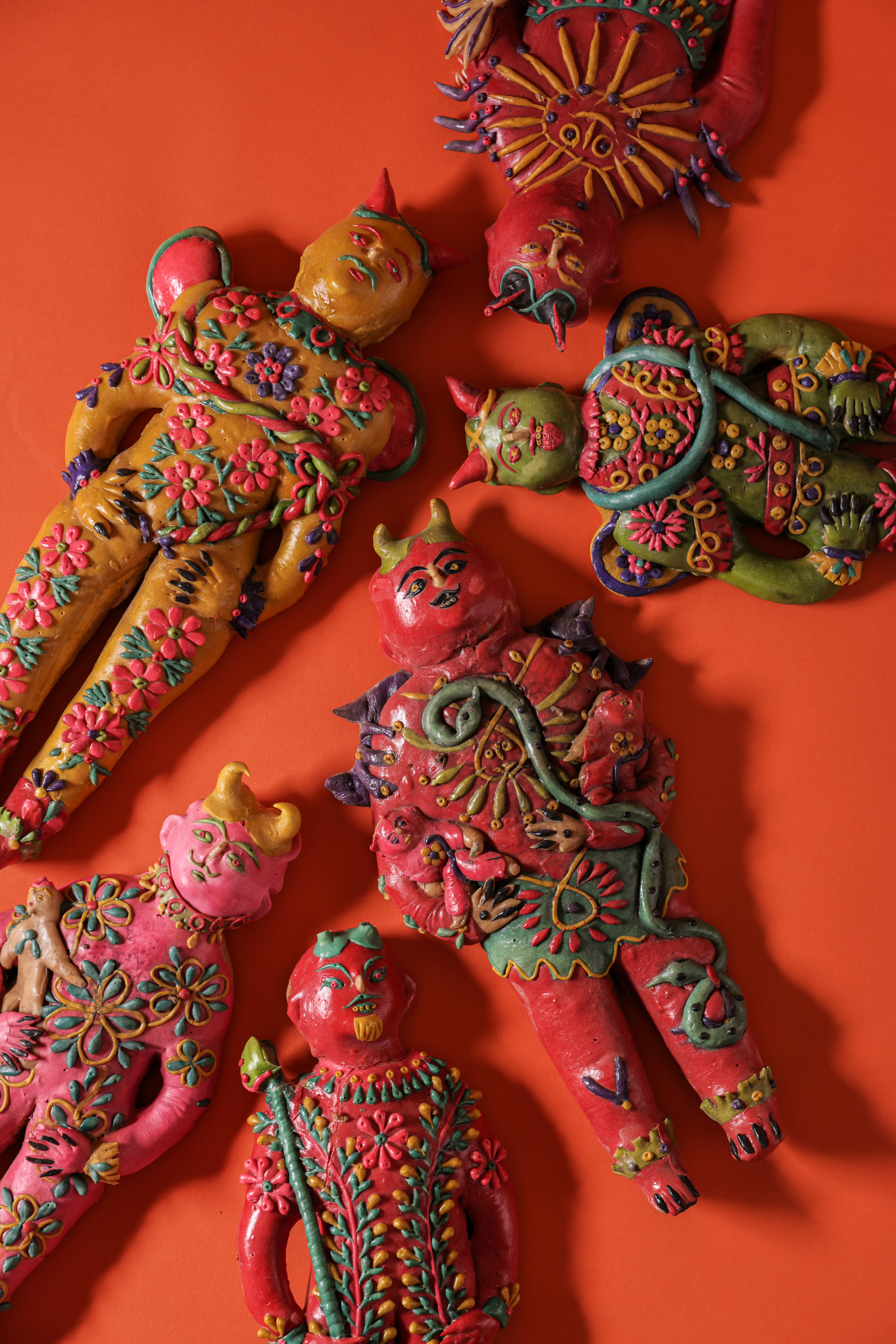 Folk Art’s Divine 6 A group of devil figures that look as if they are made from dough.