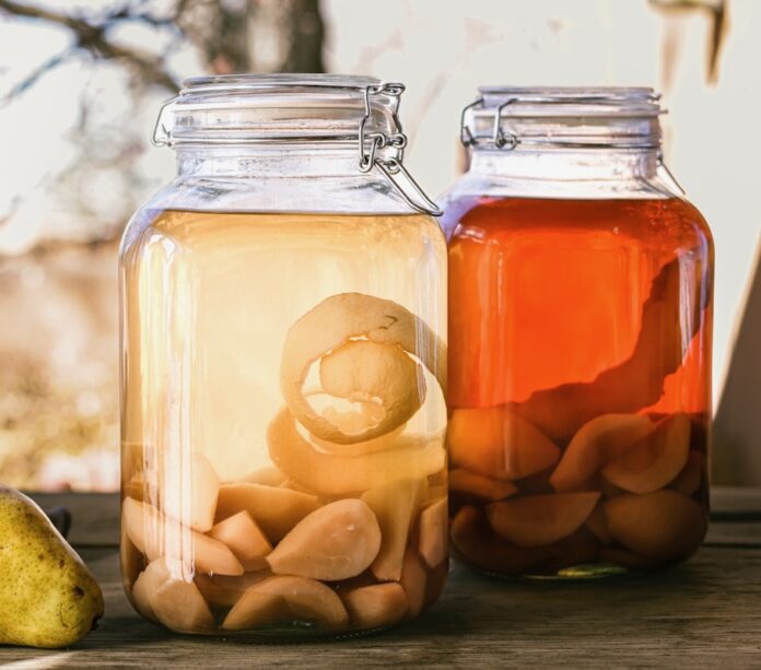 Pear Brandy Pear Brandy in mason jars with pear on side