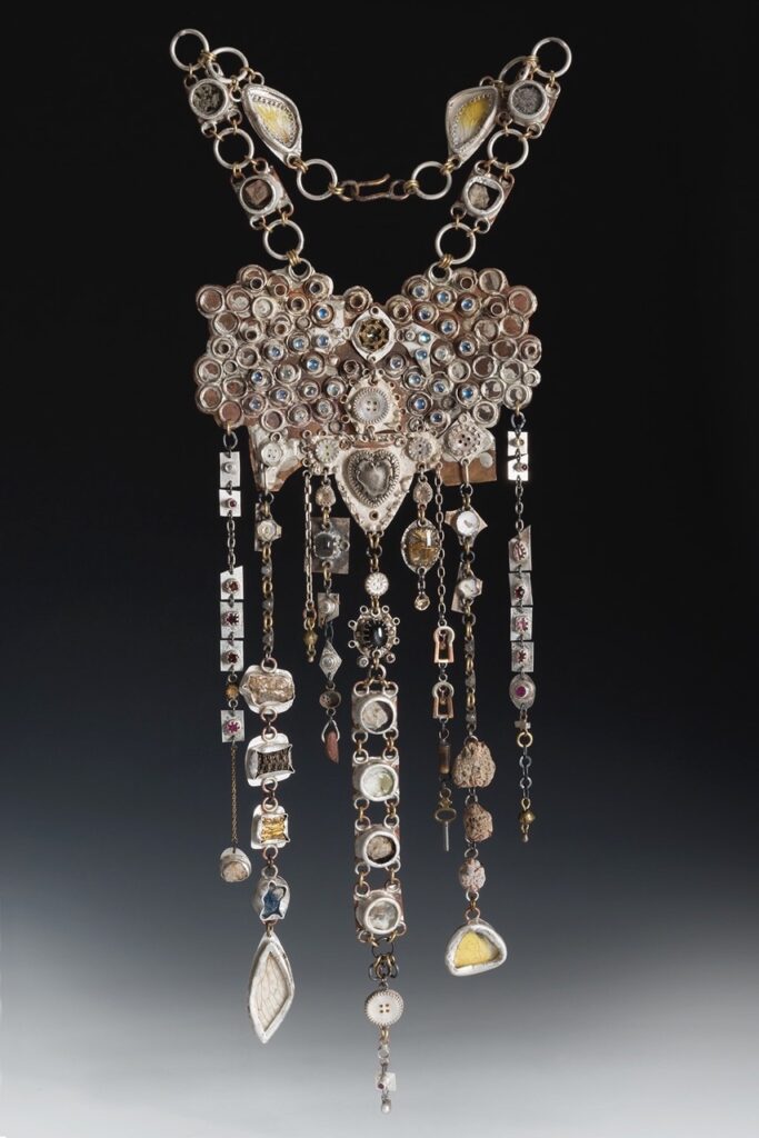 A hanging decor of beads and gems in silver.