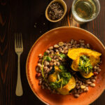 ROASTED ACORN SQUASH WITH LEMONY PINTO BEANS & ZHOUG