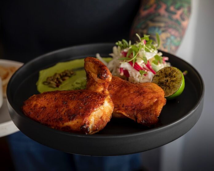 Plate of smoked chicken on a plate at MESA Provisions