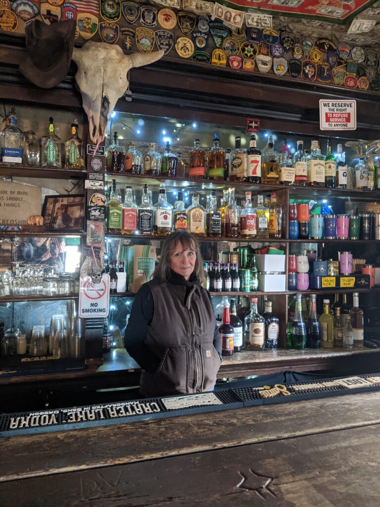 so scum allowed bar inside look with shelves of bottles behind bar