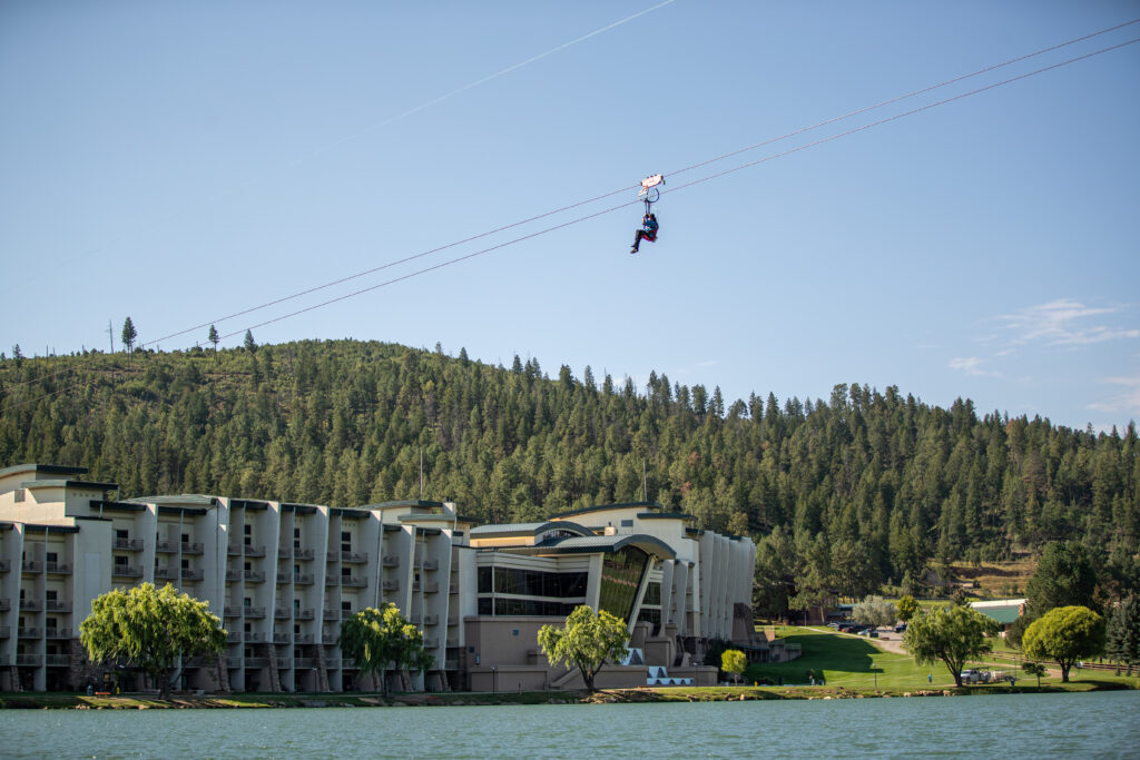 resort in front of water with zip line in view