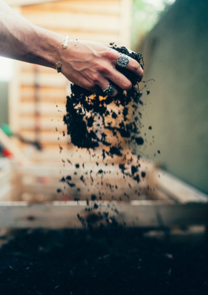 two hands holding falling soil from jack's garden