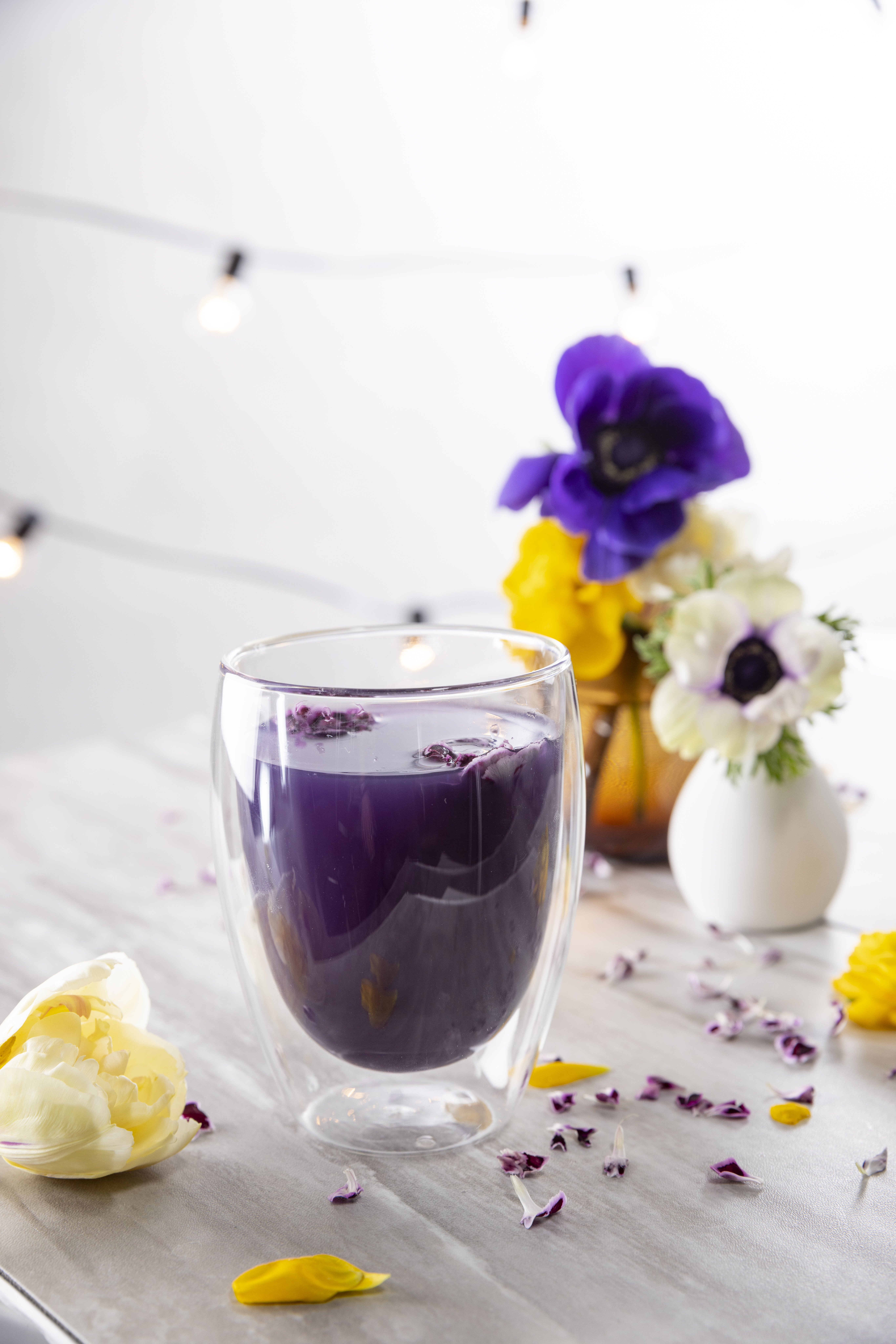 UbeLemonade 1 glass with purple ube lemonade on white table