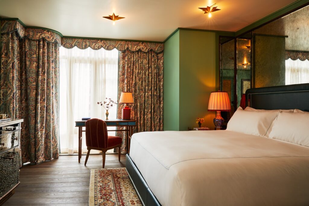 A large bed in a modern hotel room.