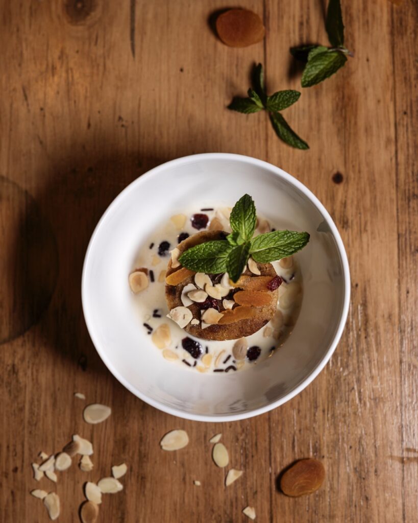 A bowl full of a soup with plenty of garnishes.