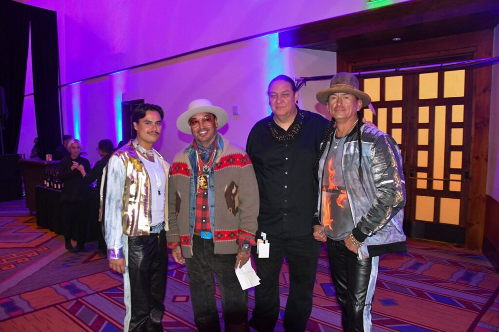 Santa Fe Indian Market 2025 Recap TABLE Magazine 4 Four people stand together at a party.