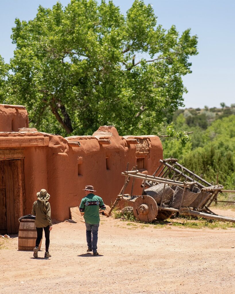 An aztec clay house in the middle of the desert.