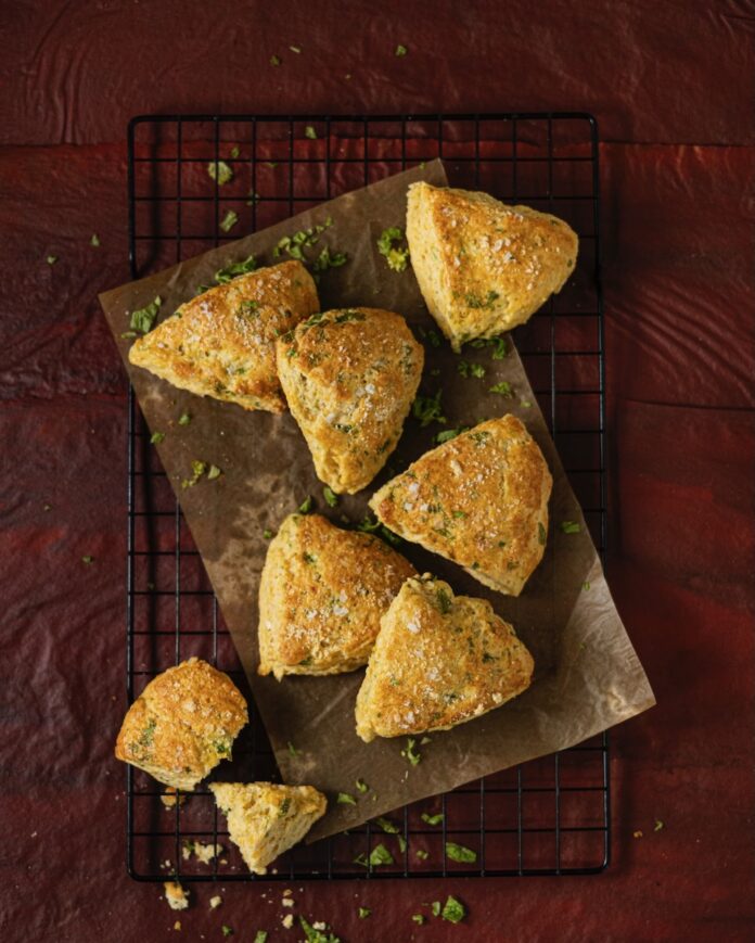 Savory Kale, Cheese, and Cornmeal Scones on a baking sheet.