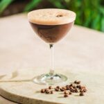 Espresso Maiztini with coffee beans in foreground