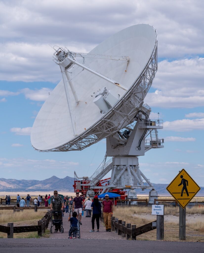 A large satellite in the middle of a field.