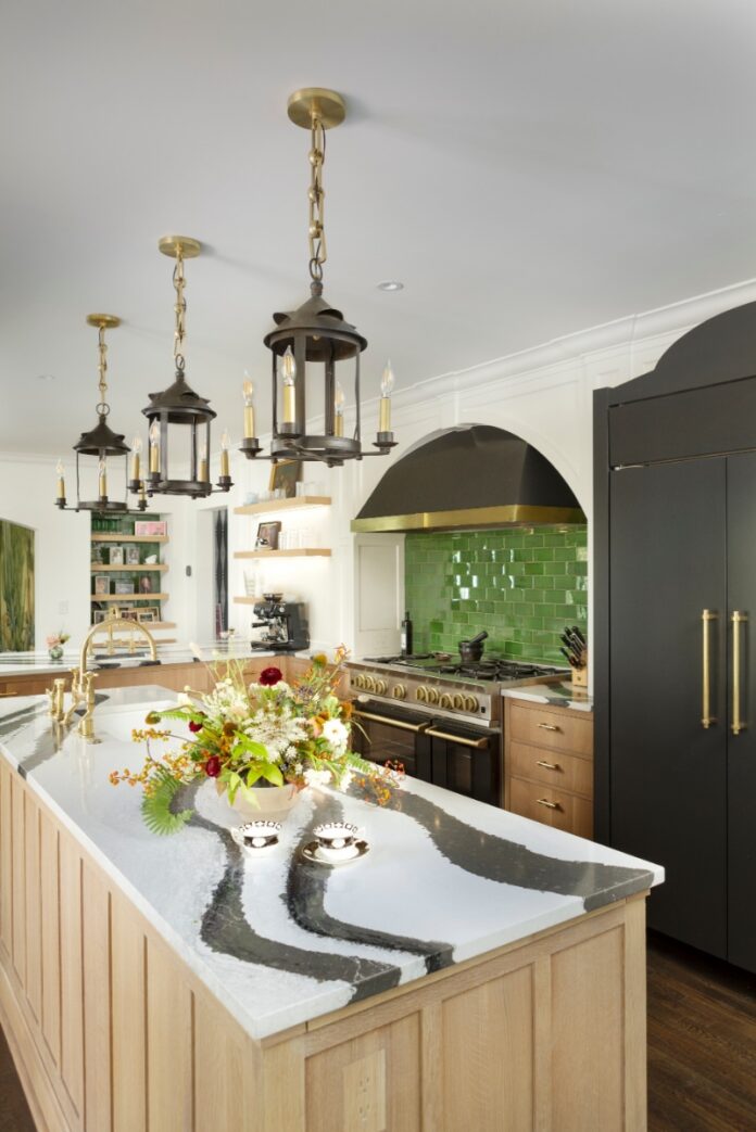 A modern Santa Fe living room featuring a neutral sectional sofa, a rustic wooden coffee table, and large black-framed windows, designed by French & French Interiors.