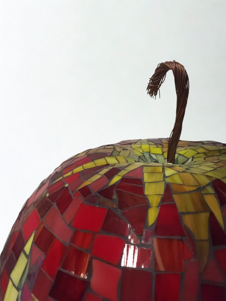 A glass mosaic apple.