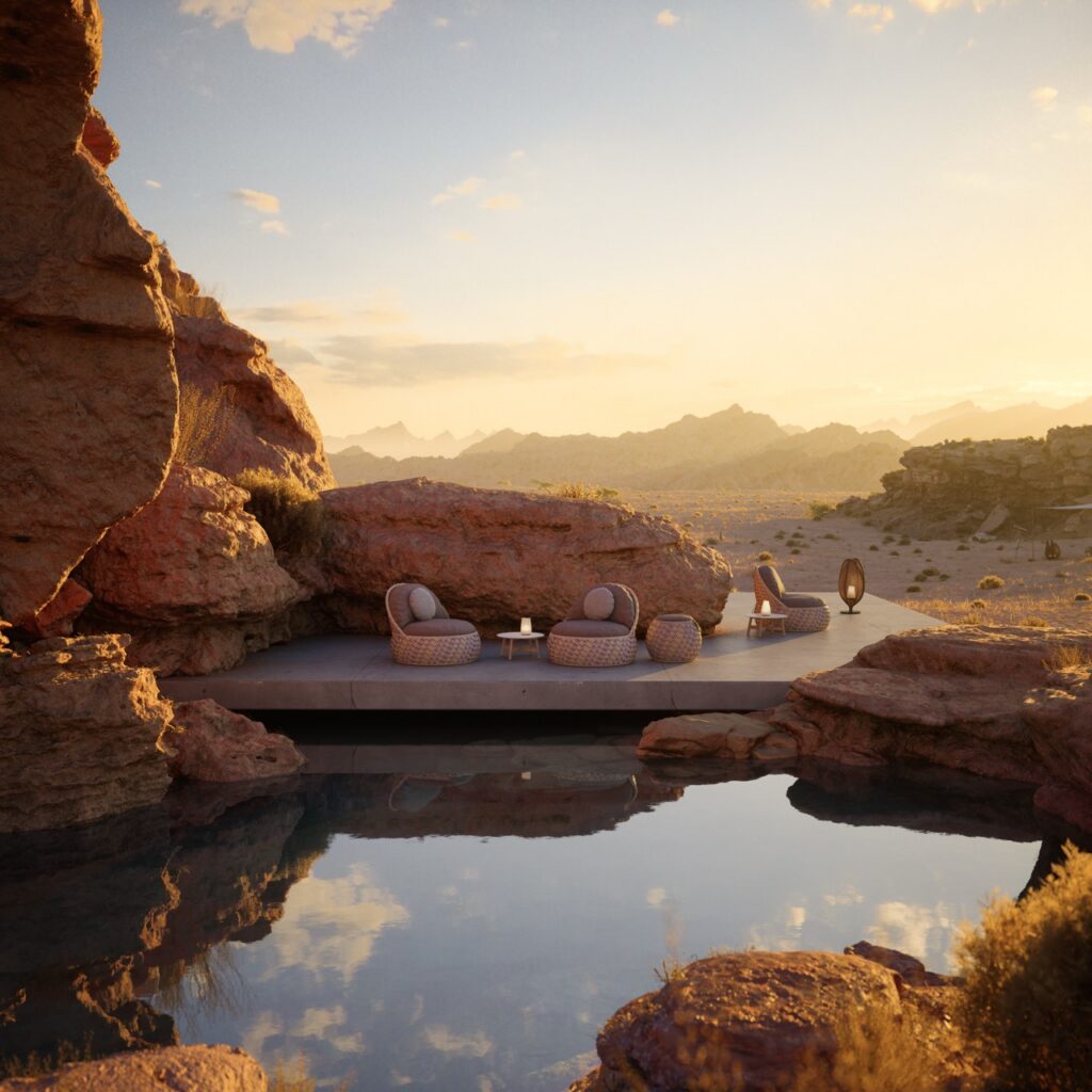 A cliffside edge by a pool of water with three lounge chairs in wicker sitting on the dock.