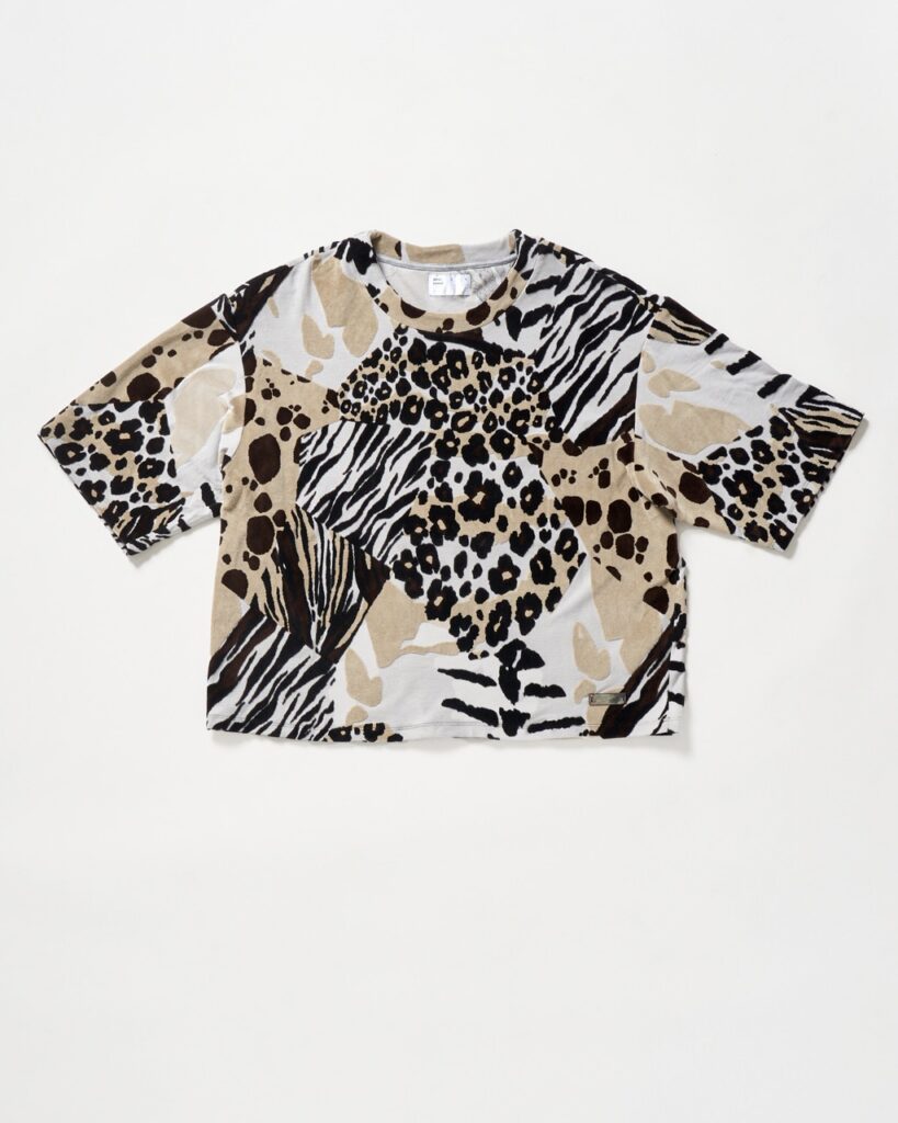 A t shirt that's a collage of various prints like cheetah, leopard, and zebra.